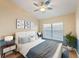 Cozy bedroom featuring bright blue accents, modern furniture, and lots of natural light at 441 Thicket Crest Rd, Seffner, FL 33584