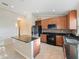 Spacious kitchen featuring an island, dark countertops, and tile flooring at 441 Thicket Crest Rd, Seffner, FL 33584