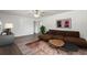 Modern living room featuring dark wood laminate flooring, a contemporary sofa, and stylish decor at 4935 42Nd N Pl, St Petersburg, FL 33709