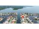 Aerial view of canal community featuring waterfront homes with private boat docks at 5008 Southshore Dr, New Port Richey, FL 34652