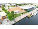 Aerial view of home featuring boat dock, and easy access to the serene canal at 5008 Southshore Dr, New Port Richey, FL 34652