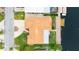Overhead aerial view of the home with tile roof, lush lawn and canal access at 5008 Southshore Dr, New Port Richey, FL 34652
