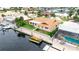 Aerial view of home with dock, showcasing waterfront access to the stunning canal at 5008 Southshore Dr, New Port Richey, FL 34652