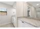 Elegant bathroom with granite countertops, modern fixtures, and a mirror at 5008 Southshore Dr, New Port Richey, FL 34652