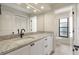 Bathroom vanity featuring stone countertop, undermount sink, and modern black faucet at 5008 Southshore Dr, New Port Richey, FL 34652