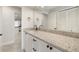 Bathroom with updated vanity, stone countertop, black fixtures and integrated sink at 5008 Southshore Dr, New Port Richey, FL 34652