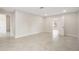 Spacious bedroom with a neutral color scheme and open doorway to another room at 5008 Southshore Dr, New Port Richey, FL 34652