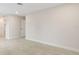 Open bedroom layout with neutral walls, tile floors, and a closet with sliding doors at 5008 Southshore Dr, New Port Richey, FL 34652
