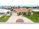 Charming single-story home featuring a beautiful terracotta roof and a spacious circular driveway at 5008 Southshore Dr, New Port Richey, FL 34652