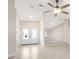 Bright foyer featuring tile flooring, high ceilings, and a view into the spacious living area at 5008 Southshore Dr, New Port Richey, FL 34652