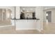 Kitchen pass through with stone counter top at 5008 Southshore Dr, New Port Richey, FL 34652