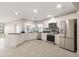 Bright kitchen features stainless appliances and stone backsplash at 5008 Southshore Dr, New Port Richey, FL 34652