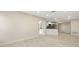 Bright living room open to a modern kitchen, featuring tile floors and recessed lighting at 5008 Southshore Dr, New Port Richey, FL 34652