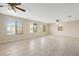 Living room with tile floors and large windows with waterfront view at 5008 Southshore Dr, New Port Richey, FL 34652