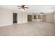 Spacious living room features tile flooring and ceiling fans at 5008 Southshore Dr, New Port Richey, FL 34652