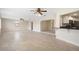 Open concept living area with tile floors, leading into the kitchen at 5008 Southshore Dr, New Port Richey, FL 34652