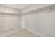 Walk-in closet interior view, highlighting built-in shelving and open storage space at 5008 Southshore Dr, New Port Richey, FL 34652