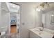 Bathroom featuring a skylight, white vanity, and an open view to the bedroom at 6514 Sunhigh Dr, New Port Richey, FL 34655