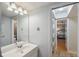 Bathroom featuring a well-lit vanity, sleek mirror, and modern fixtures, offering a clean and functional space at 6514 Sunhigh Dr, New Port Richey, FL 34655