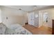 Bedroom featuring hardwood floors, with ensuite bath and walk-in closet at 6514 Sunhigh Dr, New Port Richey, FL 34655
