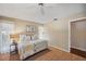 Bedroom features hardwood floors, bright windows, and a ceiling fan at 6514 Sunhigh Dr, New Port Richey, FL 34655
