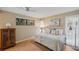 Bedroom featuring hardwood floors, a large window, and a bedside table at 6514 Sunhigh Dr, New Port Richey, FL 34655