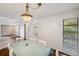 The dining room showcases natural light, table and chairs, and hardwood floors at 6514 Sunhigh Dr, New Port Richey, FL 34655