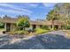 Attractive home exterior with a combination of siding and stone, complemented by well-maintained landscaping at 6514 Sunhigh Dr, New Port Richey, FL 34655