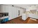 Spacious kitchen with ample storage, white cabinets, and wood look flooring at 6514 Sunhigh Dr, New Port Richey, FL 34655