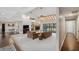 Bright and airy living room with vaulted ceiling, skylight, fireplace, and sliding glass doors leading to the backyard at 6514 Sunhigh Dr, New Port Richey, FL 34655