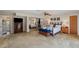 Spacious carpeted main bedroom with large closet and dark furnishings at 6514 Sunhigh Dr, New Port Richey, FL 34655