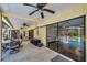 Expansive covered patio area offering seamless transition to the screened pool, perfect for relaxing and entertaining at 6514 Sunhigh Dr, New Port Richey, FL 34655