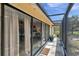 Covered outdoor patio with sliding glass doors leading inside at 6514 Sunhigh Dr, New Port Richey, FL 34655