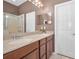 Double vanity in bathroom with tile floor and a shower at 6902 47Th N Ln, Pinellas Park, FL 33781