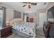 Bedroom featuring a ceiling fan, neutral paint, and a decorative comforter at 6902 47Th N Ln, Pinellas Park, FL 33781