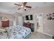 Spacious bedroom with ceiling fan and ensuite bathroom at 6902 47Th N Ln, Pinellas Park, FL 33781