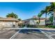 View of the community center with mailbox kiosk and tropical landscaping at 6902 47Th N Ln, Pinellas Park, FL 33781