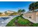 Sawgrass Village community sign with tropical landscaping and blue sky backdrop at 6902 47Th N Ln, Pinellas Park, FL 33781