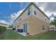 Exterior view of home featuring a well-maintained lawn and neutral two-tone paint at 6902 47Th N Ln, Pinellas Park, FL 33781