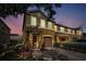 Inviting two-story townhome with a well-manicured lawn, and an attached single-car garage at 6902 47Th N Ln, Pinellas Park, FL 33781