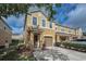 Inviting two-story townhome with a well-manicured lawn, and an attached single-car garage at 6902 47Th N Ln, Pinellas Park, FL 33781