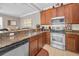 Open kitchen featuring granite countertops, stainless steel appliances and views to the living room at 6902 47Th N Ln, Pinellas Park, FL 33781