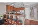 Kitchen with wood cabinets, granite countertops, stainless appliances, and breakfast bar seating at 6902 47Th N Ln, Pinellas Park, FL 33781