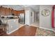Modern kitchen featuring wood cabinets, granite counters, stainless steel appliances, and breakfast bar seating at 6902 47Th N Ln, Pinellas Park, FL 33781