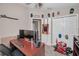 A well lit office with desk, monitors, chair and novelty decor at 6902 47Th N Ln, Pinellas Park, FL 33781