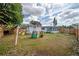 Great backyard featuring a swing set and playhouse area for children at 7108 N Howard Ave, Tampa, FL 33604