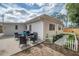 This backyard has it all: beautiful patio, cozy seating, and professionally landscaped flower beds at 7108 N Howard Ave, Tampa, FL 33604