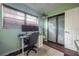 Bright office space featuring two monitors, a filing cabinet, laminate flooring, and a hanging plant at 7108 N Howard Ave, Tampa, FL 33604