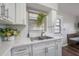 Bright kitchen with ample counter space, stainless steel sink, and convenient access to the dining area at 7108 N Howard Ave, Tampa, FL 33604