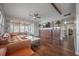 Bright living room featuring hardwood floors, custom shelving, and a sunroom at 7108 N Howard Ave, Tampa, FL 33604